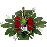 Foto van Luxe bloemstuk met mousserende witte wijn via burobloemen