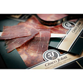 Foto van 5j jamon iberico pata negra handgesneden ham naturel 100gram via burobloemen